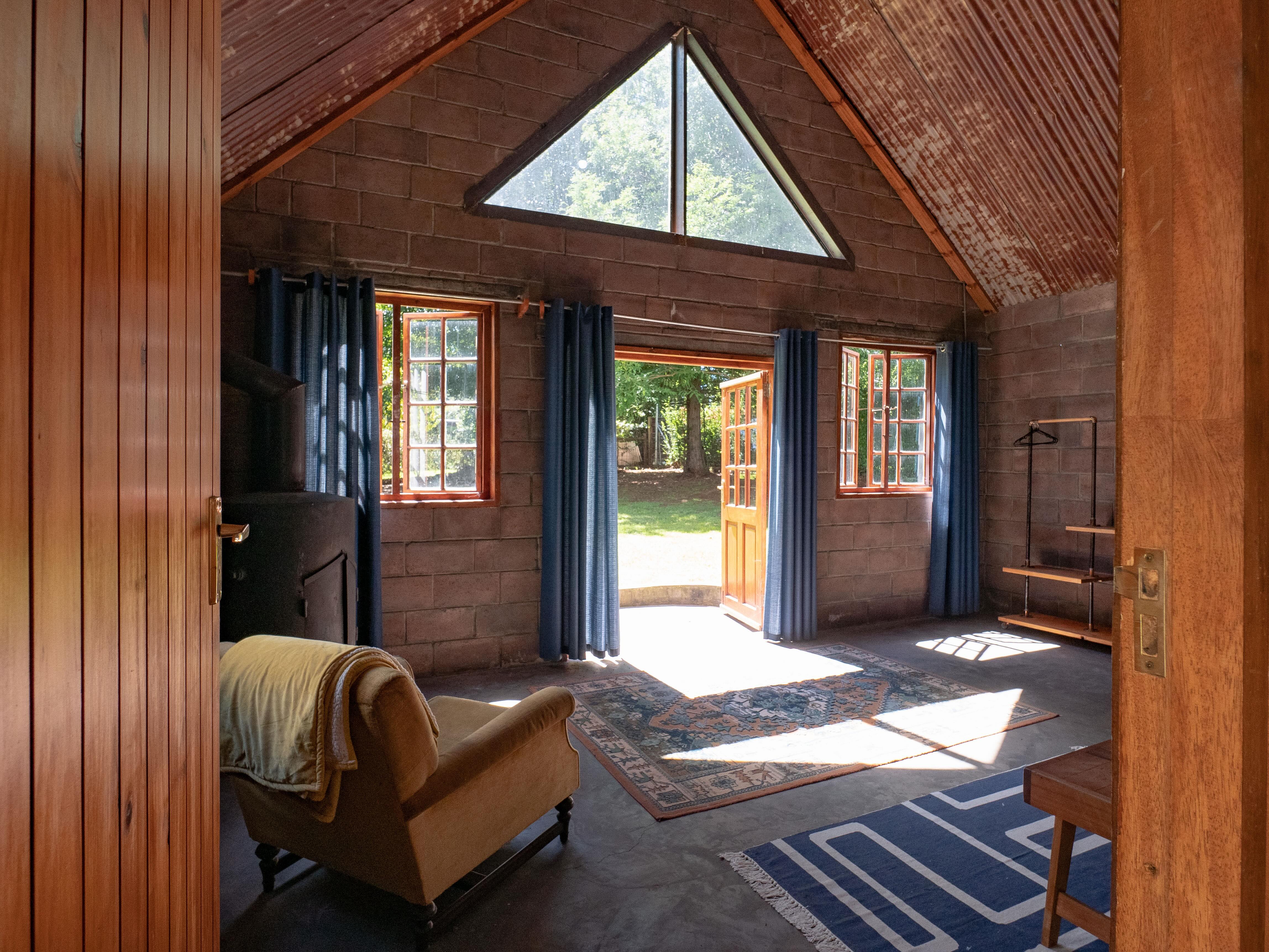 Cottage living area with triangular window