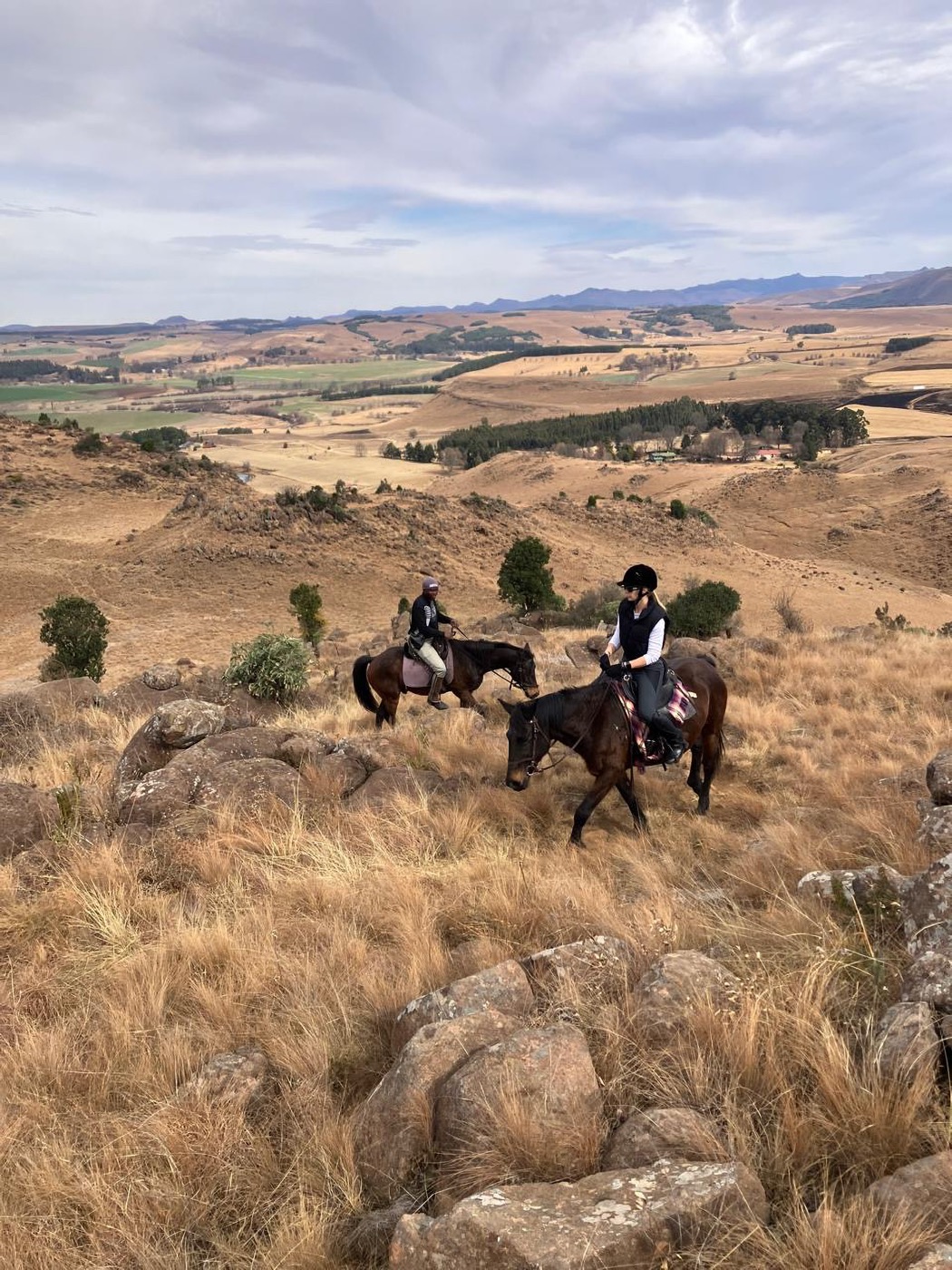 Horse riders above the Underberg valley at Khotso
